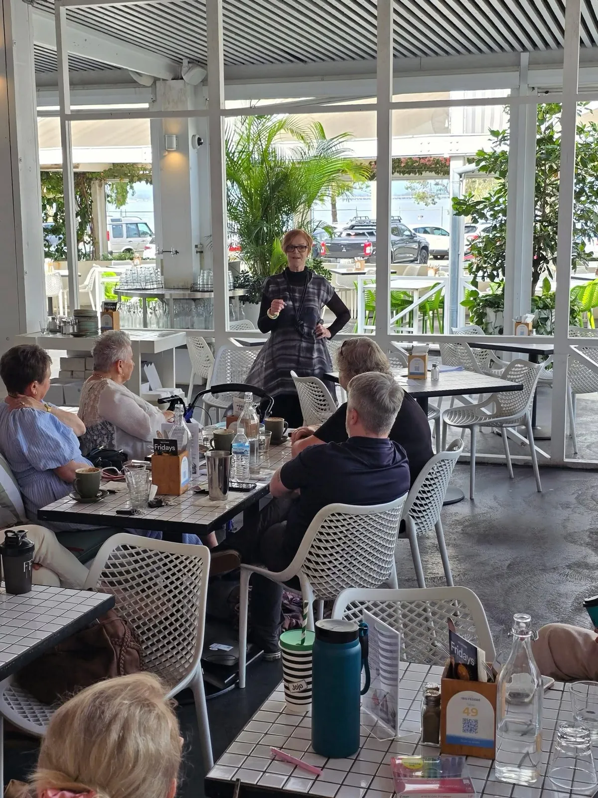Sandra Tainsh speaking at The Belvedere, with the room looking on